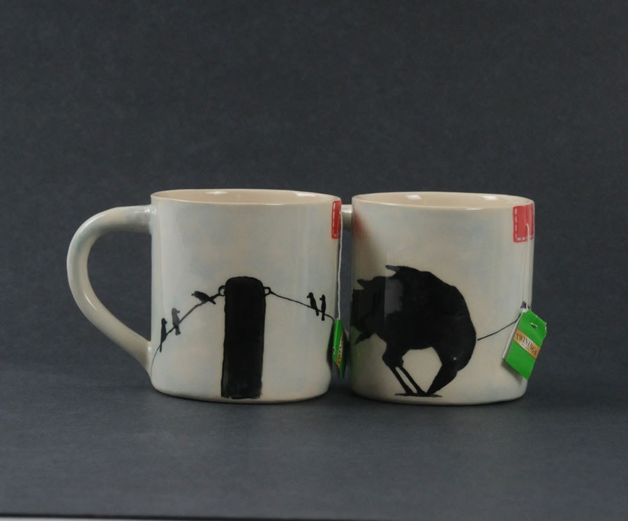 Crow mugs with tea bag slit